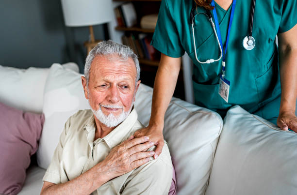 istock Senior man being supported by his nurse 2159832639