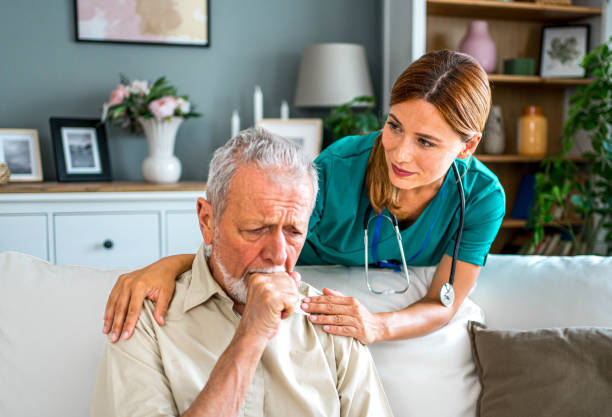 istock Home nurse caring for her elderly patient 2159832863
