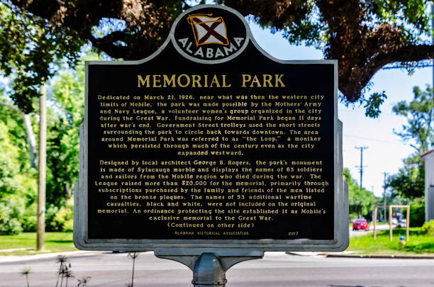 Mobile, Alabama, USA - June 23, 2024: Memorial Park is pictured on Government Street in Mobile, Alabama. The park was built in 1926 and includes a fountain and a World War I monument made of Sylacauga marble.