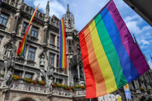 istock Brightly coloured Pride flags in Munich's Marienplatz 2159836678