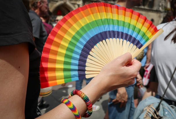 istock Holding a rainbow coloured fan during Christopher Street Day in Munich 2159836698
