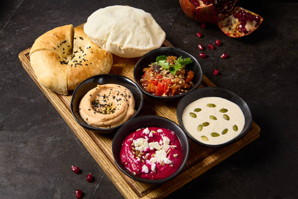 Assorted Middle Eastern Dips with Pita and Flatbread - Hummus, Beetroot Hummus, Ajapsandali, and Tonnato Sauce