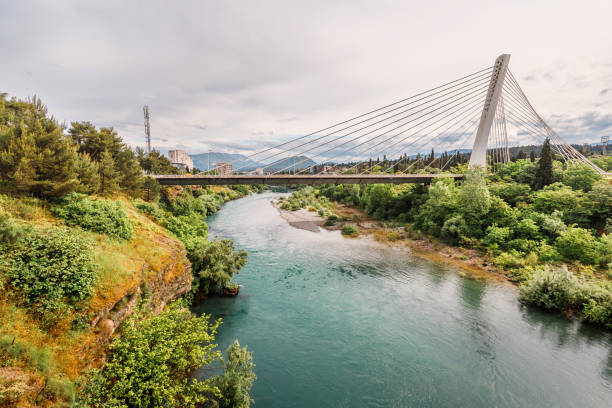 istock In Podgorica, Montenegro, the Moraca River serves as a captivating backdrop to the city's architecture and skyline, offering travelers a beautiful view of nature and historic buildings 2159843541