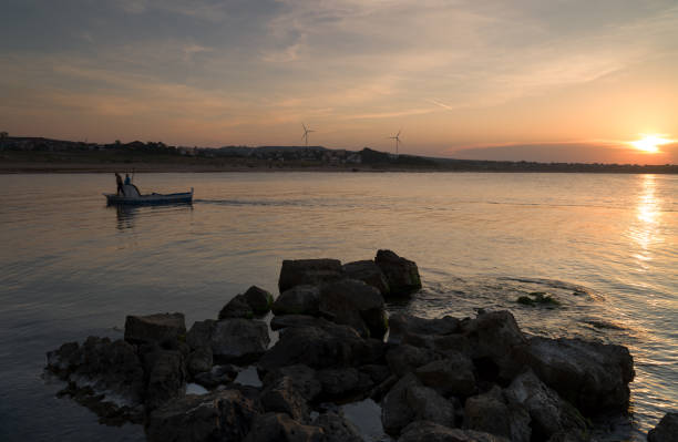 Sunset and fishing boat. Babali beach, Kandira, Kocaeli, Turkey