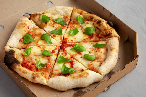 istock Organic Margarita Pizza with Basil and Mozarella in a Box 2159851775