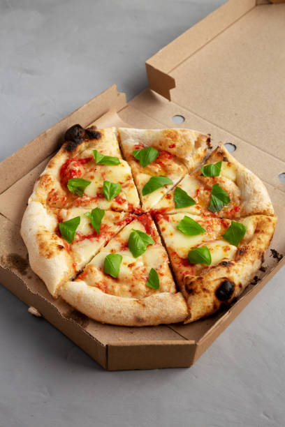 istock Organic Margarita Pizza with Basil and Mozarella in a Box 2159851780