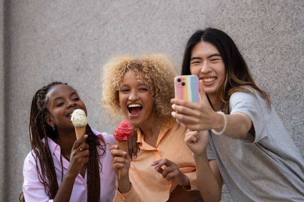 istock Multiethnic friends with icecream taking a selfie 2159853501