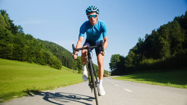 istock Male athlete riding a racing cycle 2159855495