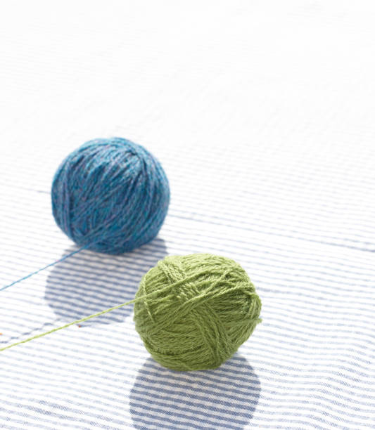 A photo of two balls of yarn