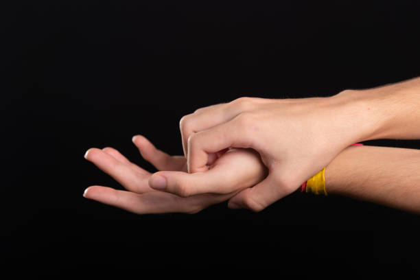 Itchy hands. Skin disease. Irritation, allergy. man isolated on black background.
