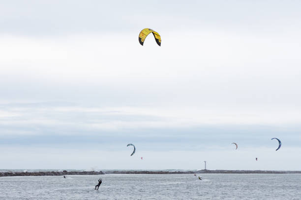 stockholm sweden januari - 11 - 2022 - an unknown man goes kitesurfing on a lake called drevviken but for the city of stockholm in tyresö municipality