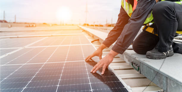 istock Technology solar cell  Engineers walking on roof inspect and check solar cell panel  service check installation solar cell on the roof of factory  repair solar cell on the roof of the factory. 2159867799