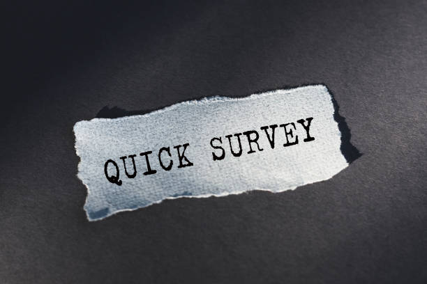 istock QUICK SURVEY. Words written on ripped and torn paper. 2159868063