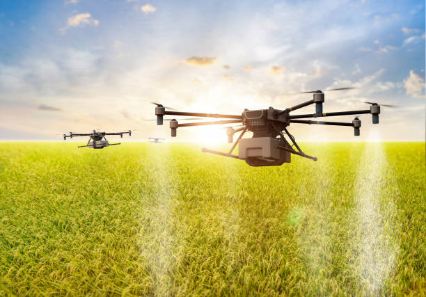 istock Agriculture technology with drone fly above and spray fertilizer 2159868114