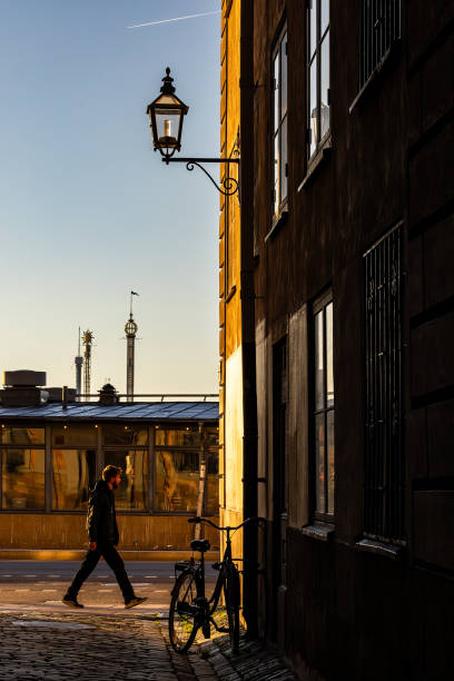 Stockholm, Sweden June 24, 2024 A person walks by the narrow street Tullgrand on Old Town or Gamla Stan.