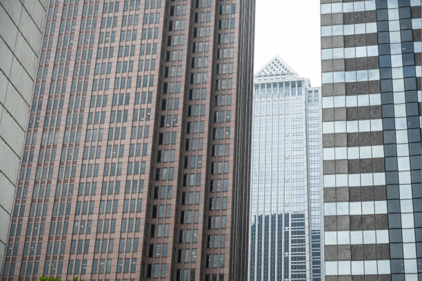 Modern business skyscrapers, high-rise buildings, architecture raising to the sky, sun. Concepts of financial, economics, future etc.