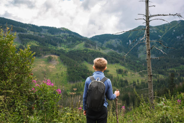 istock Boy hiking in the mountains 2159872316