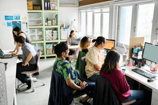 istock Startup team working together on new business project 2159893574