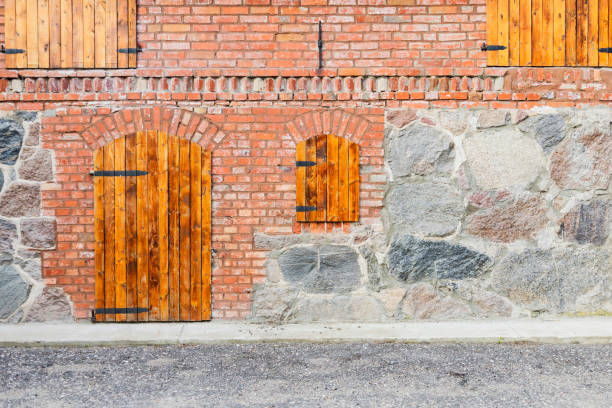 Ancient wooden arched door of medieval house