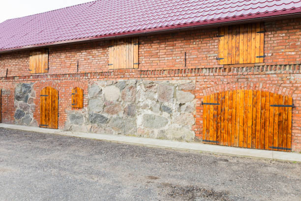 istock Brick wall with wooden shutters on windows adds rustic charm to the building 2159894508