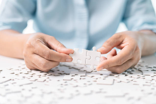 istock Developing strategic approach to each challenge in business is like piecing together jigsaw puzzle, solution fits into place with careful planning and steady hand, ultimately leading to success. 2159894560