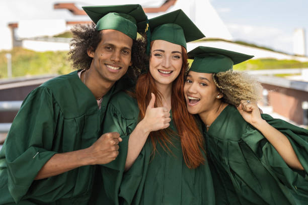 istock Diverse Group of Graduates Celebrating Together 2159894801