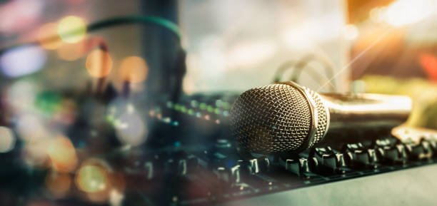 Close-up microphone and sound mixer in studio for sound record control system and audio equipment and music instrument.