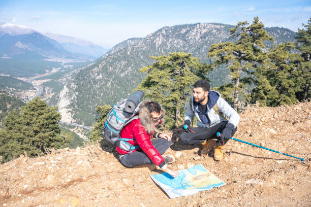 istock Hiking friends with map in mountain. 2159899586