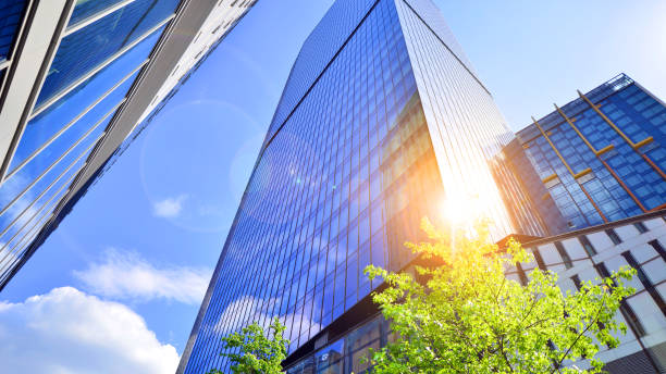 istock Sustainable glass office building with trees for reducing carbon dioxide. 2159899819