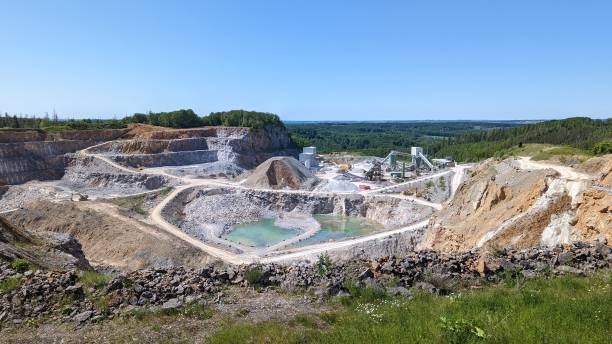 Open pit mine. Open pit mining of minerals and sand for construction