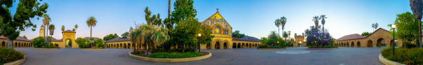 A stunning panoramic view of Stanford University’s campus captured at sunset, highlighting the beautiful architecture and lush greenery. The vibrant colors and serene atmosphere showcase the iconic beauty of one of the world’s leading educational institutions.