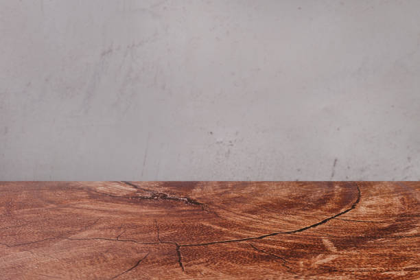 istock Abstract background with wooden tabletop and concrete wall 2159902120
