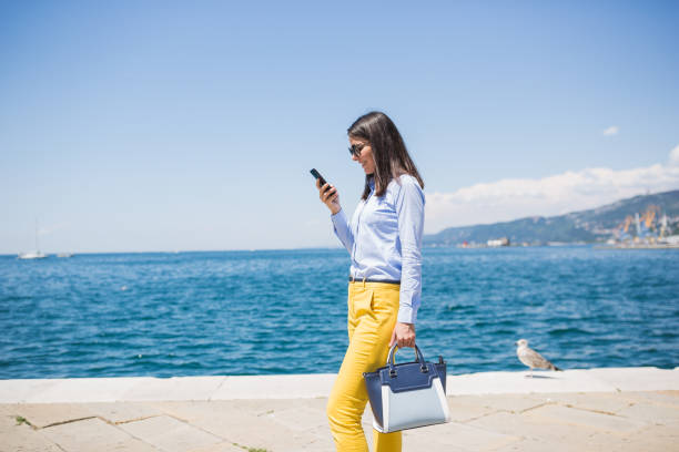 istock Walking Along the Waterfront on a Sunny Day 2159902759