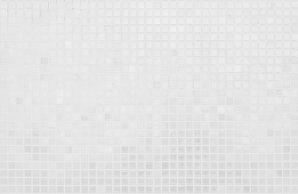 istock White tile wall chequered background bathroom texture. Ceramic brick wall and floor tiles mosaic background in bathroom and kitchen clean. Design pattern geometric with grid wallpaper decoration. 2159903993