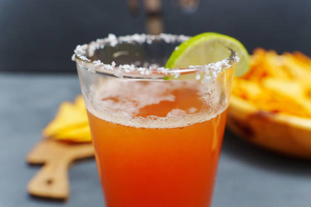 istock Mexican cocktail, michelada, made with beer and tomato juice. Selective focus 2159904018