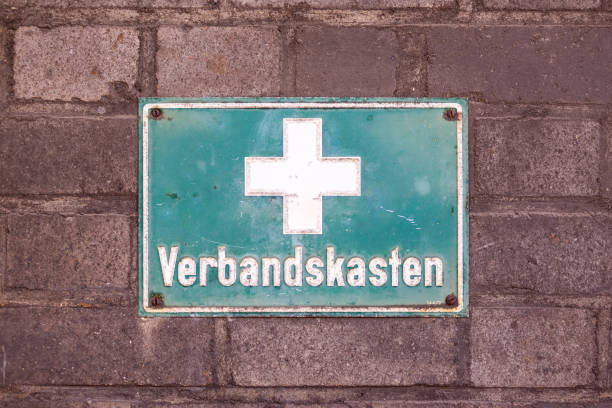 istock Green plate with a white cross and inscription - first aid kit 2159904280