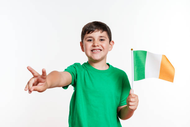 istock Boy Showing Peace Sign with Irish Flag 2159904736