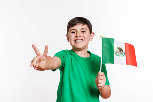 Happy Boy Showing Peace Sign with Mexican Flag