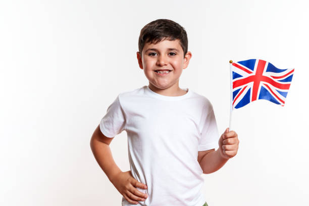 istock A young boy is holding a British flag and smiling 2159904934