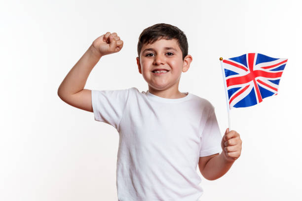 istock Celebrating Boy with UK Flag 2159904942