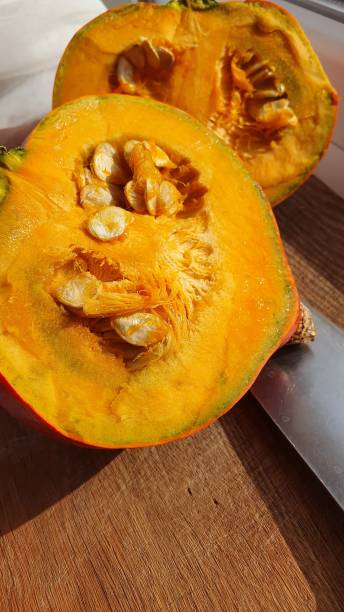 istock Sliced pumpkin in half on a cutting board 2159905257