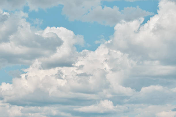 istock Bright blue sky covered with cumulus clouds 2159907412