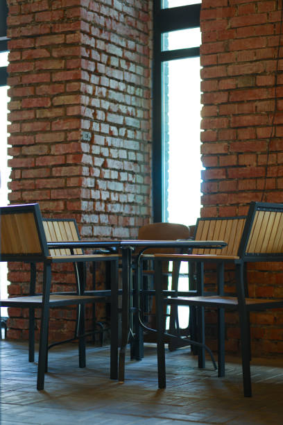 Small table with chairs around it in grunge bar..