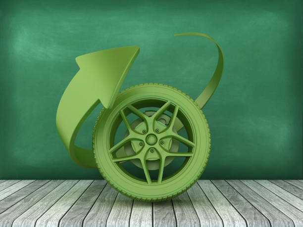 Rusty wheels on an upside down green bin outdoors.