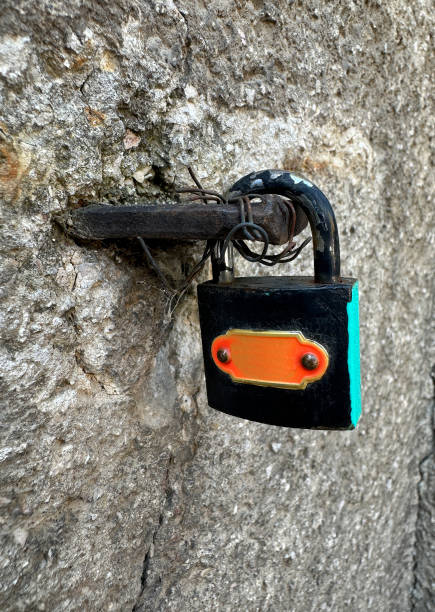 Padlock closed on the wall outdoor