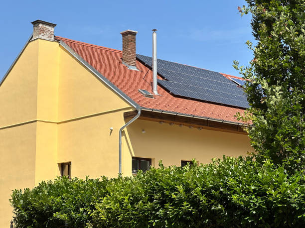 istock Solar panels on the top of a building 2159908036