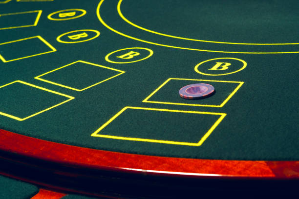 istock Casino poker table with chips and cards. 2159909081