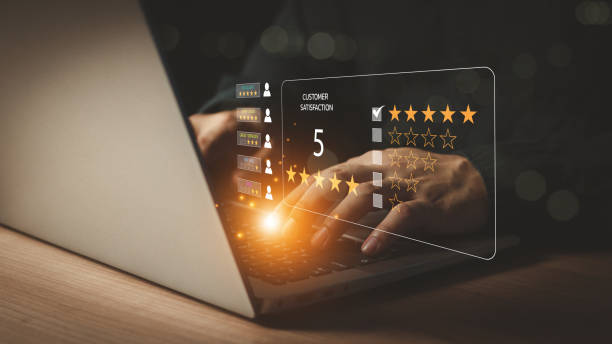 istock Customer service experience and business satisfaction survey.close up Man hand using computer Notebook with popup five star icon for feedback review satisfaction service. Satisfaction survey concept. 2159909263