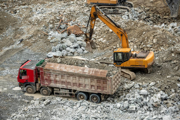 istock Excavators, crushers and trucks working on the construction site 2159911122