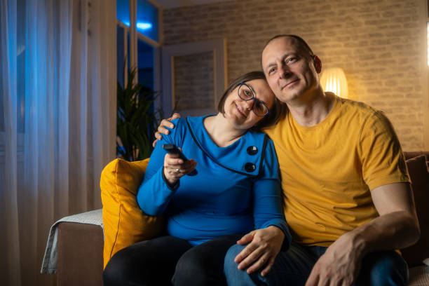 istock Couple at home watching TV 2159915162